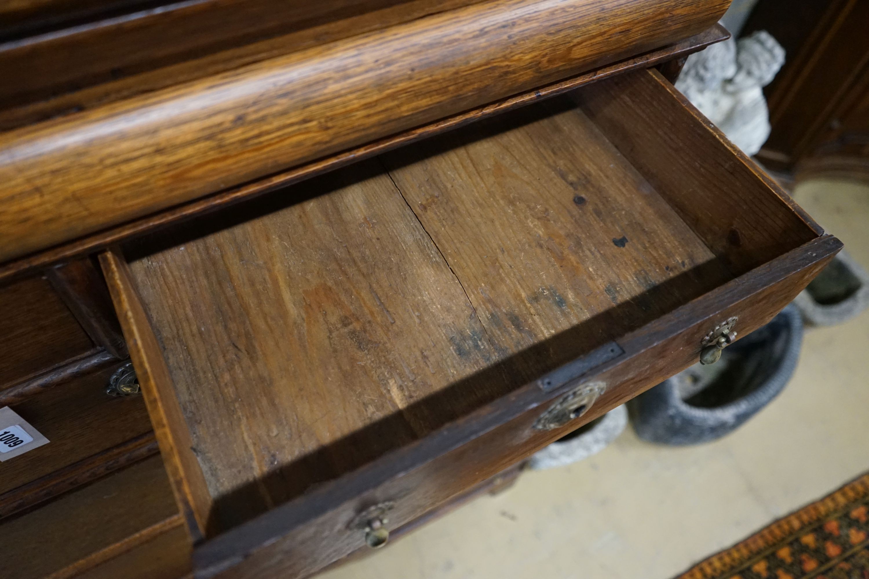 An 18th century oak chest on stand, width 104cm, depth 56cm, height 133cm